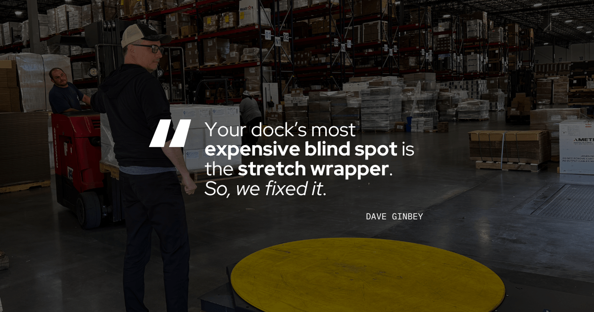 A man stands on a warehouse dock beside a forklift and an empty yellow stretch-wrapper turntable, with full storage racking behind him. Overlaid white text reads "Your dock's most expensive blind spot is the stretch wrapper," attributed to Dave Ginbey.